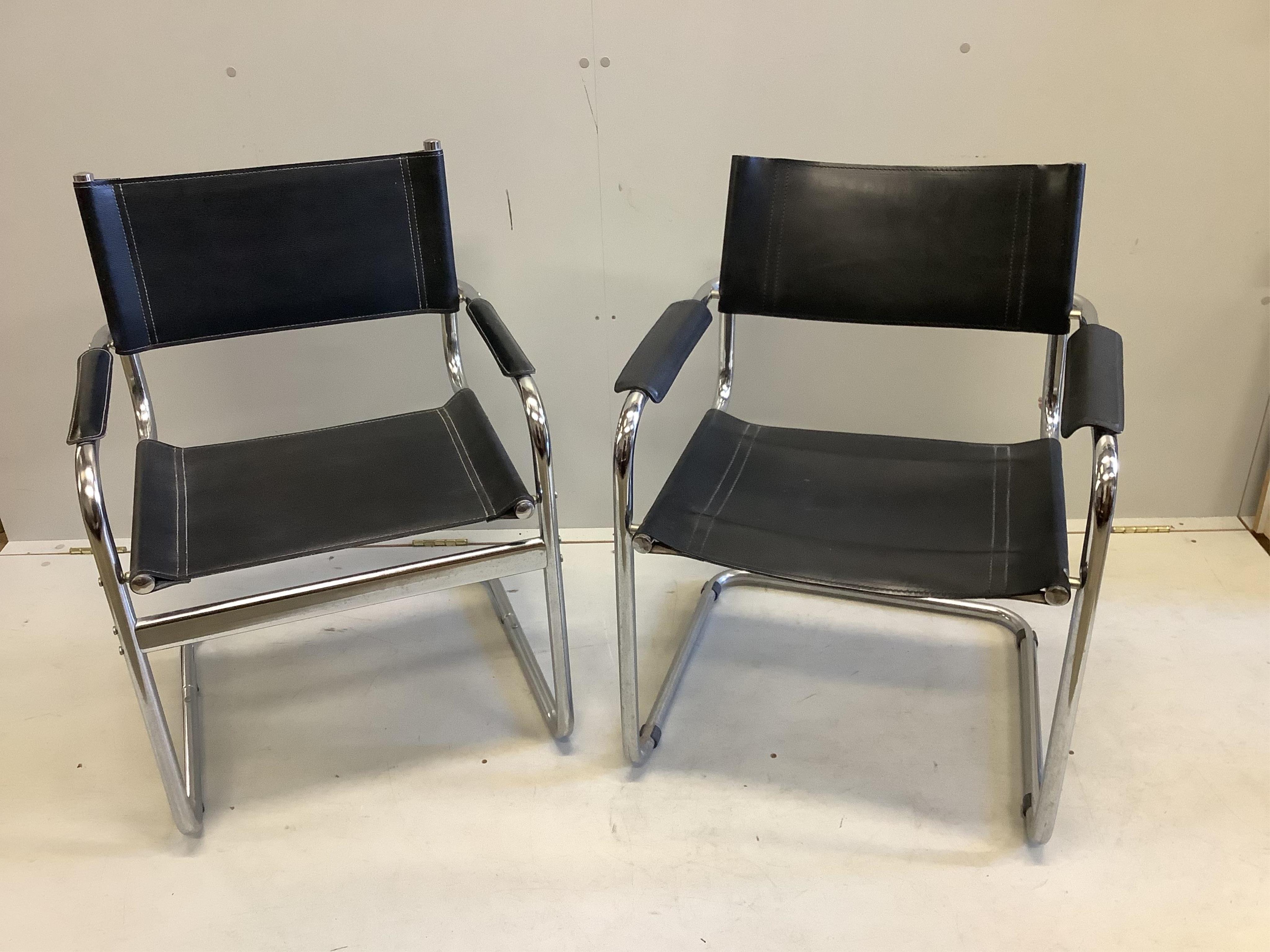 A near pair of chrome and black leather cantilever chairs, width 61cm, depth 60cm, height 80cm. Condition - fair